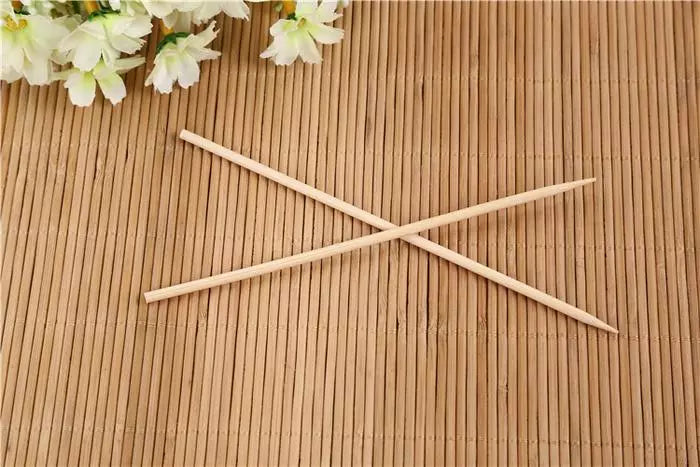 Bamboo skewers, two crossed sticks for grilling and appetizers