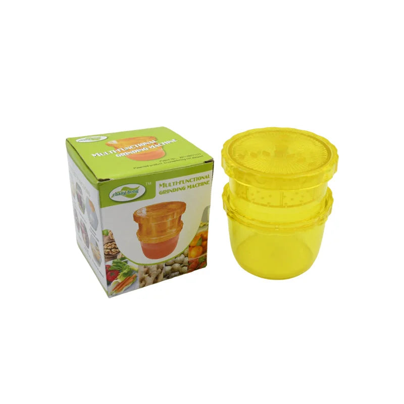 2-in-1 manual juicer with yellow container and lid, shown with retail box