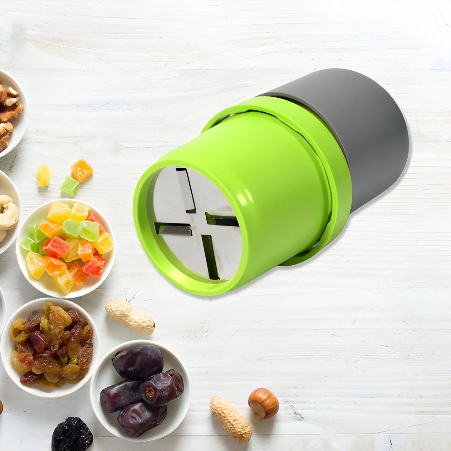 Green 3-blade food slicer cutter with gray blade housing and open cutting chamber
