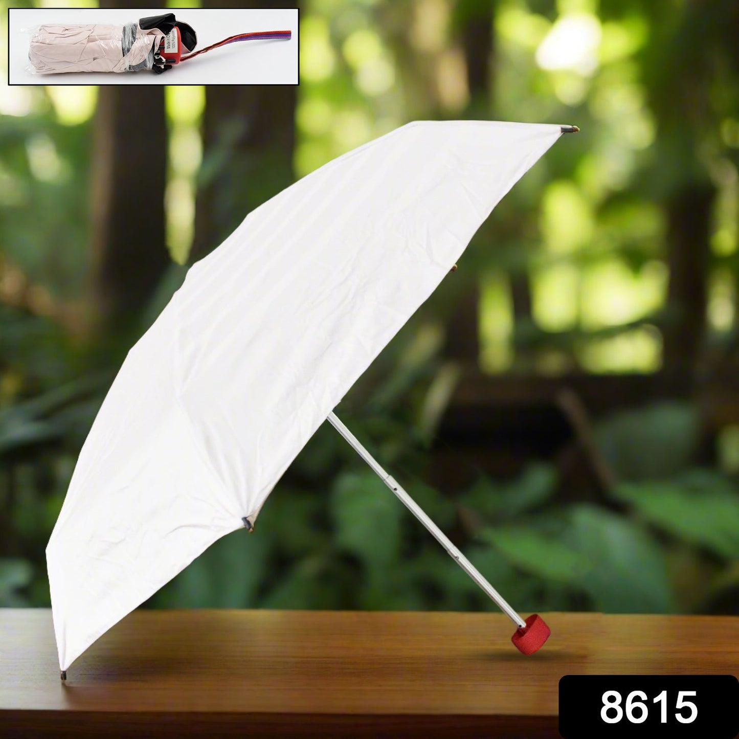 White 3-fold travel umbrella, open with straight silver handle and red tip.