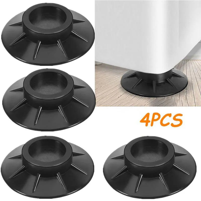 Four-piece black furniture vibration pads with circular base and 4 spikes