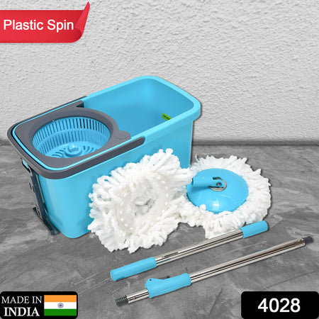 Spin mop bucket kit with blue base, two microfiber mop heads, and metal handle extensions