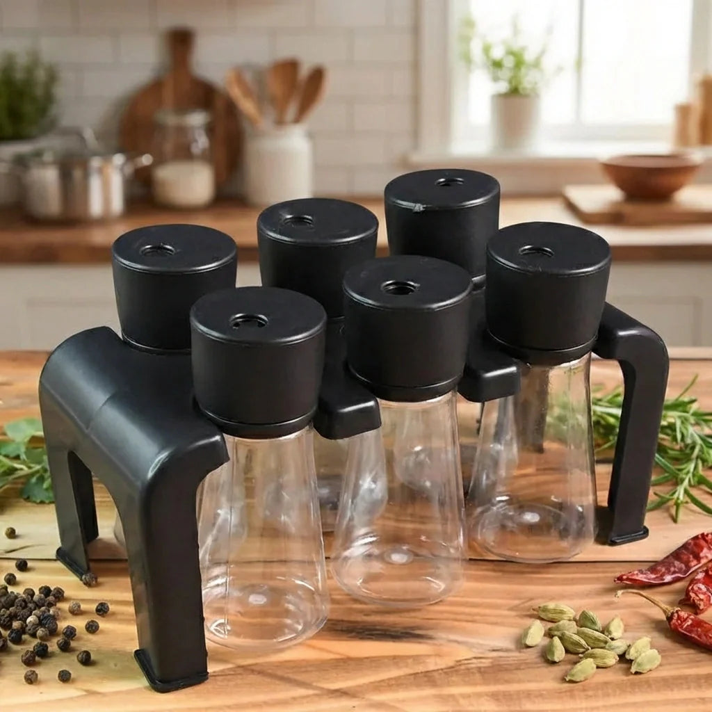 Spice jars on wooden rack with clear glass and black lids