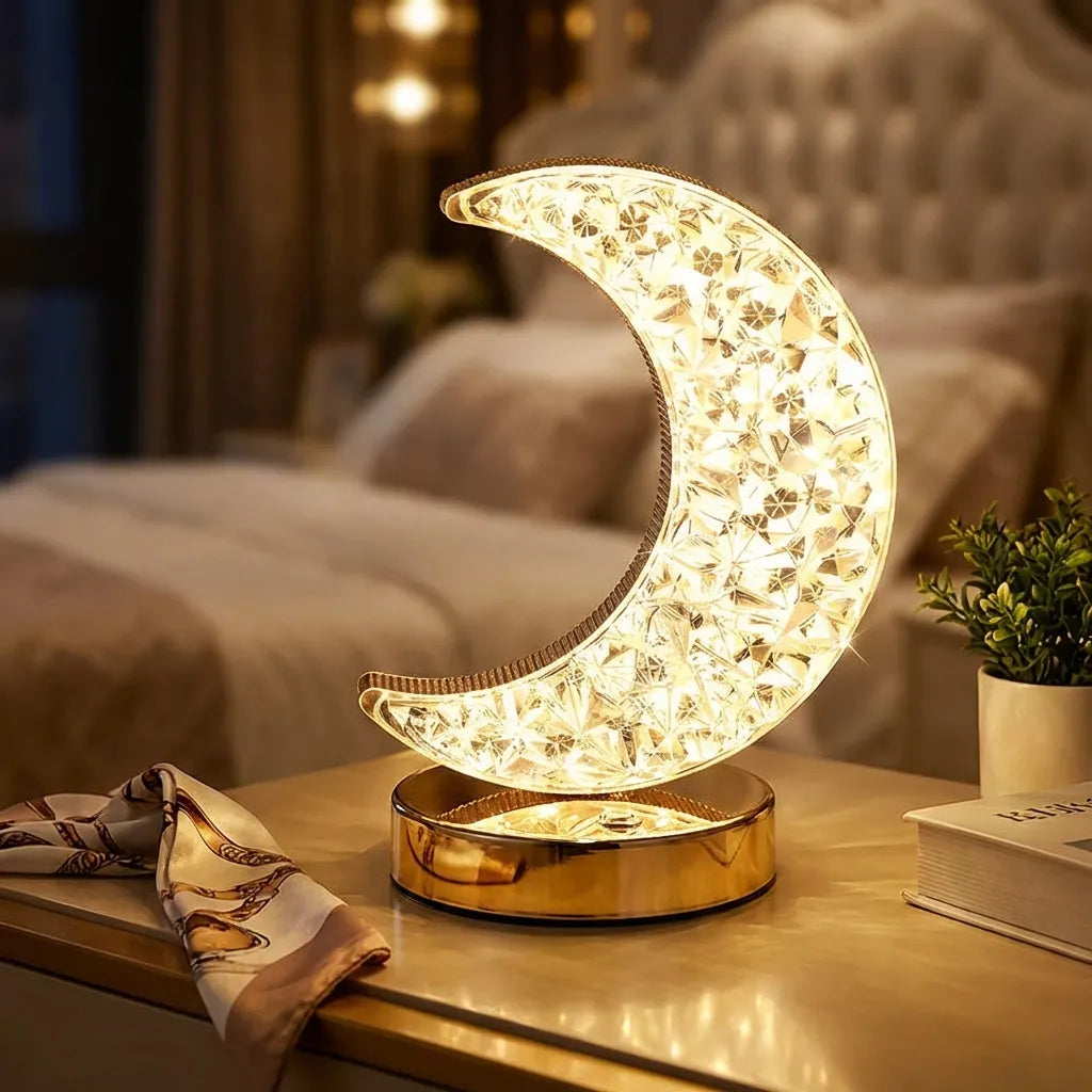Moon-shaped touch table lamp with glowing gold lattice shade on round base