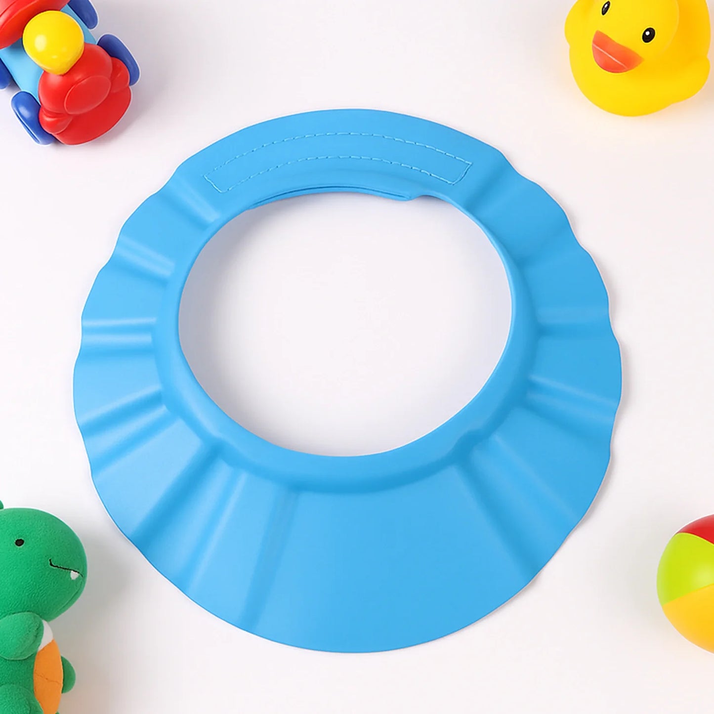Blue adjustable baby shower cap with wide circular opening