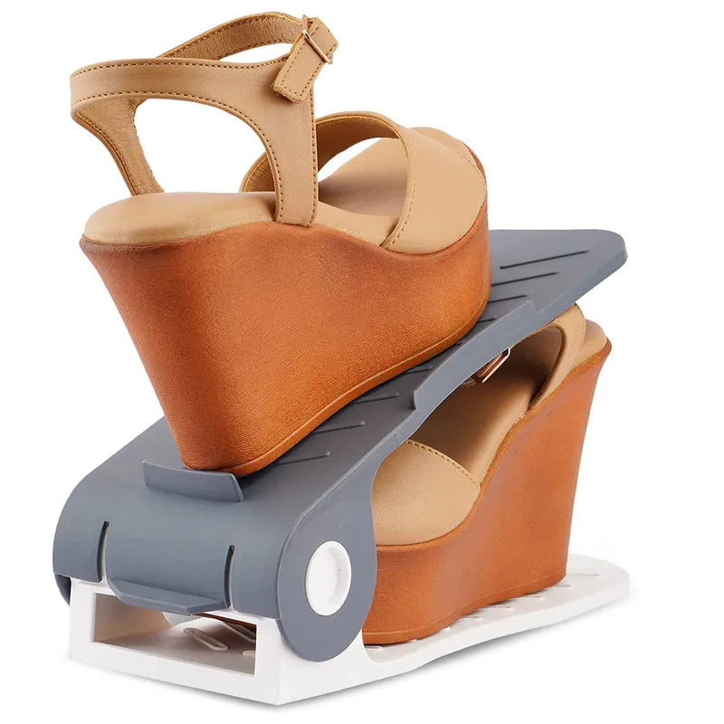 Adjustable plastic shoe organizer with gray base holding tan heeled sandal