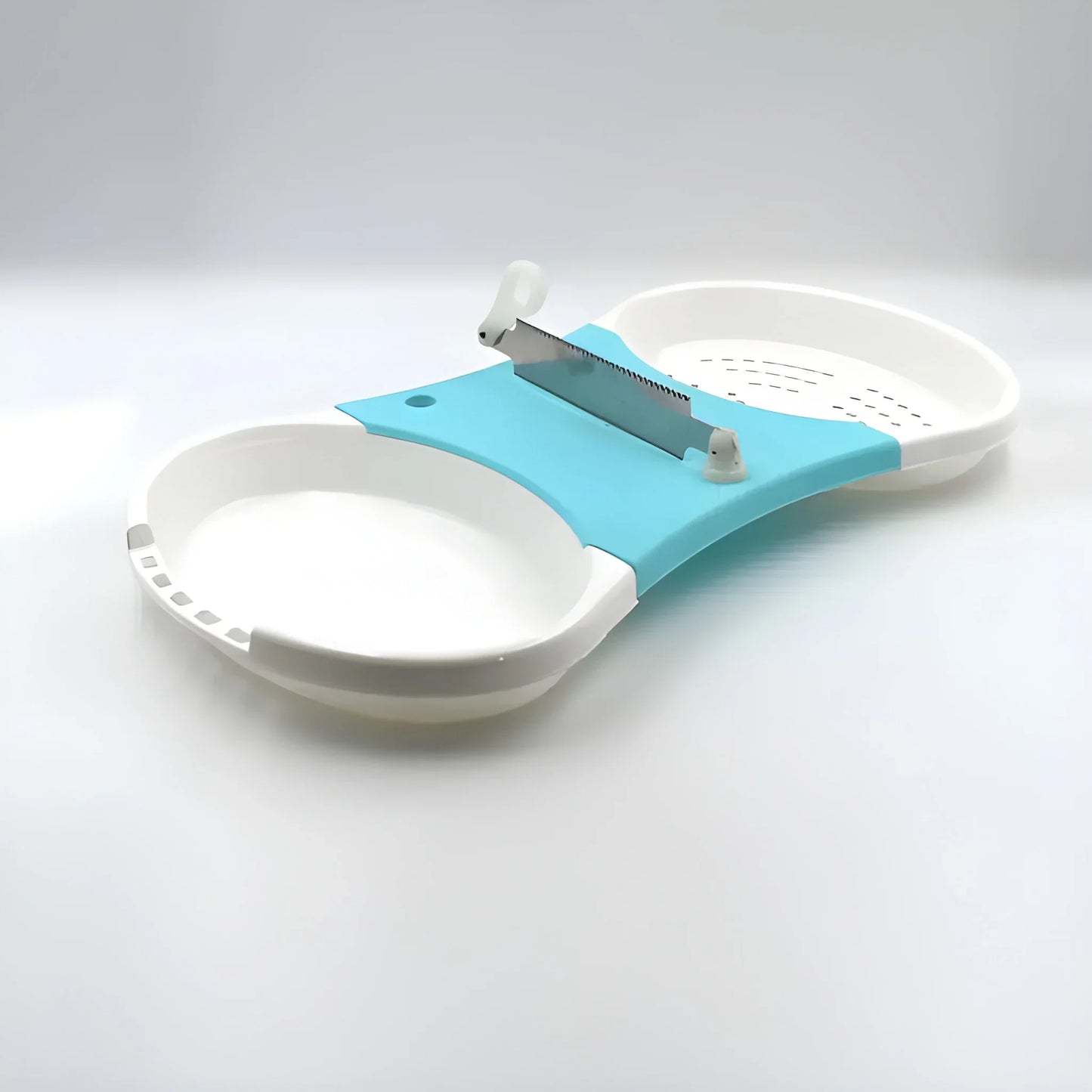 Teal and white all-in-one prep station slicer with safety ring and mounted blade