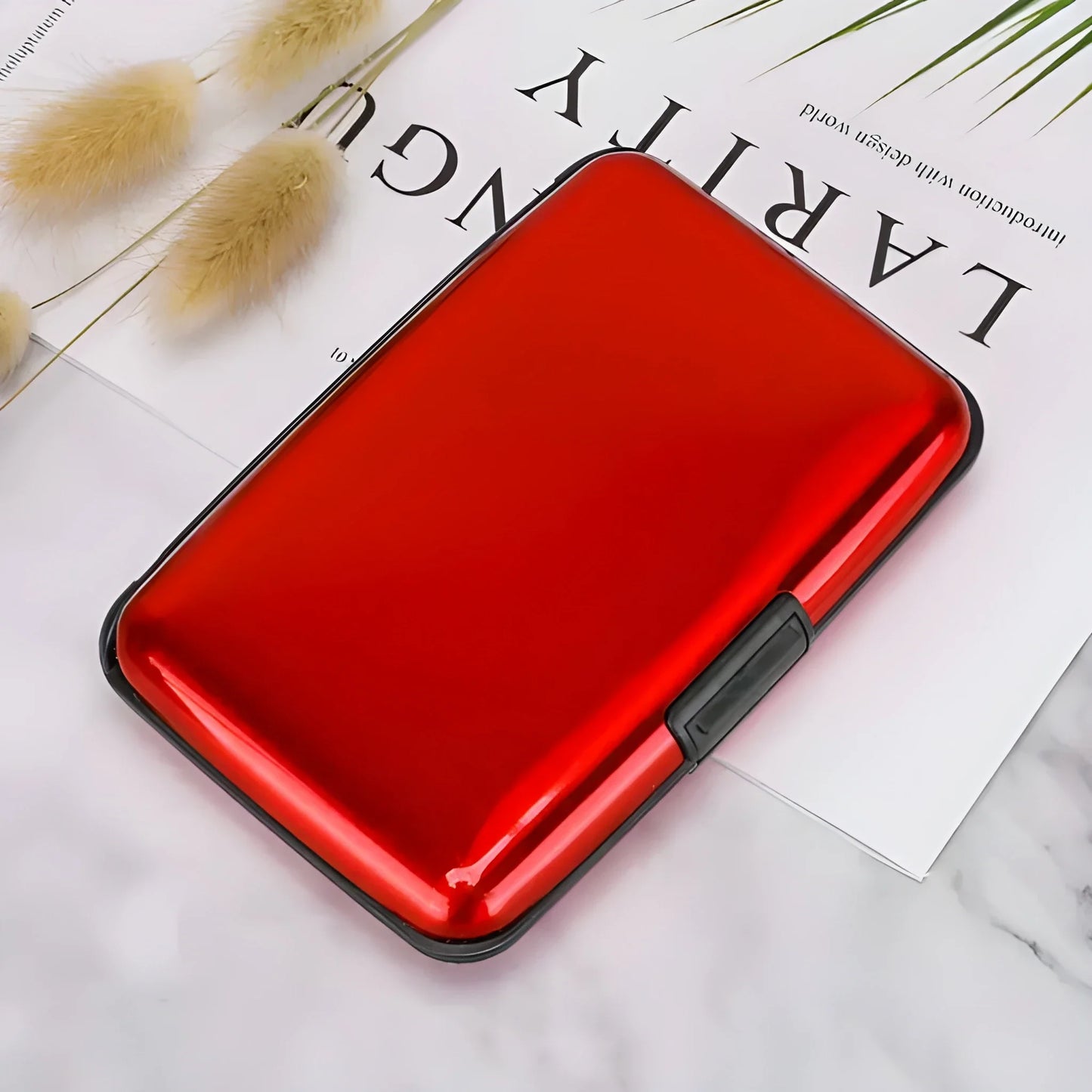 ArmorCard Pro case with glossy red front and black protective border, card-slot button