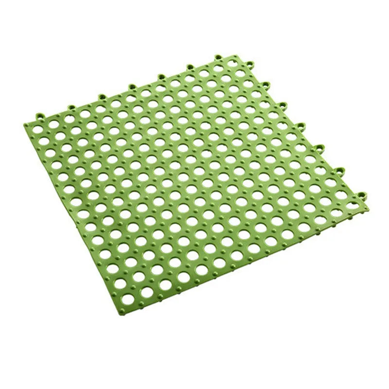 Bath anti-slip mat in green with round drainage holes