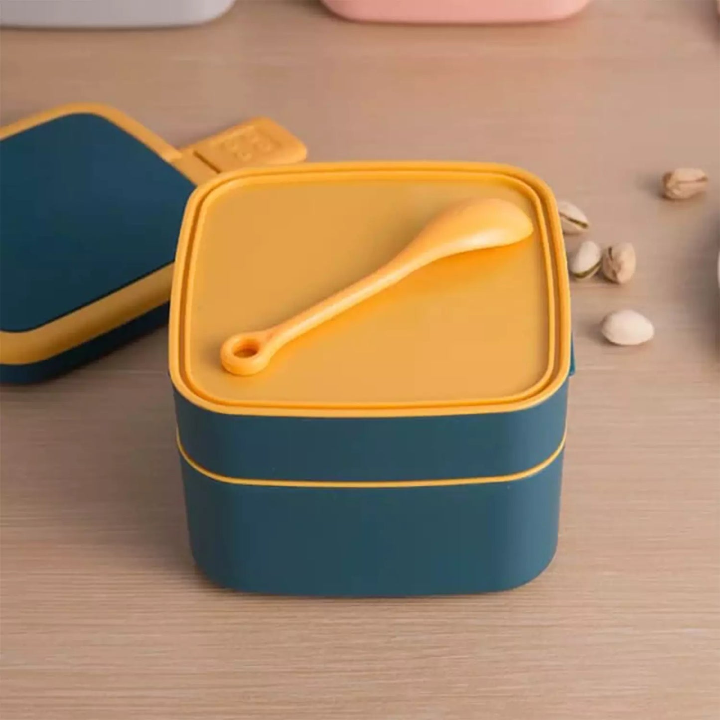 Double-layer lunch box with spoon, blue container with yellow lid interior