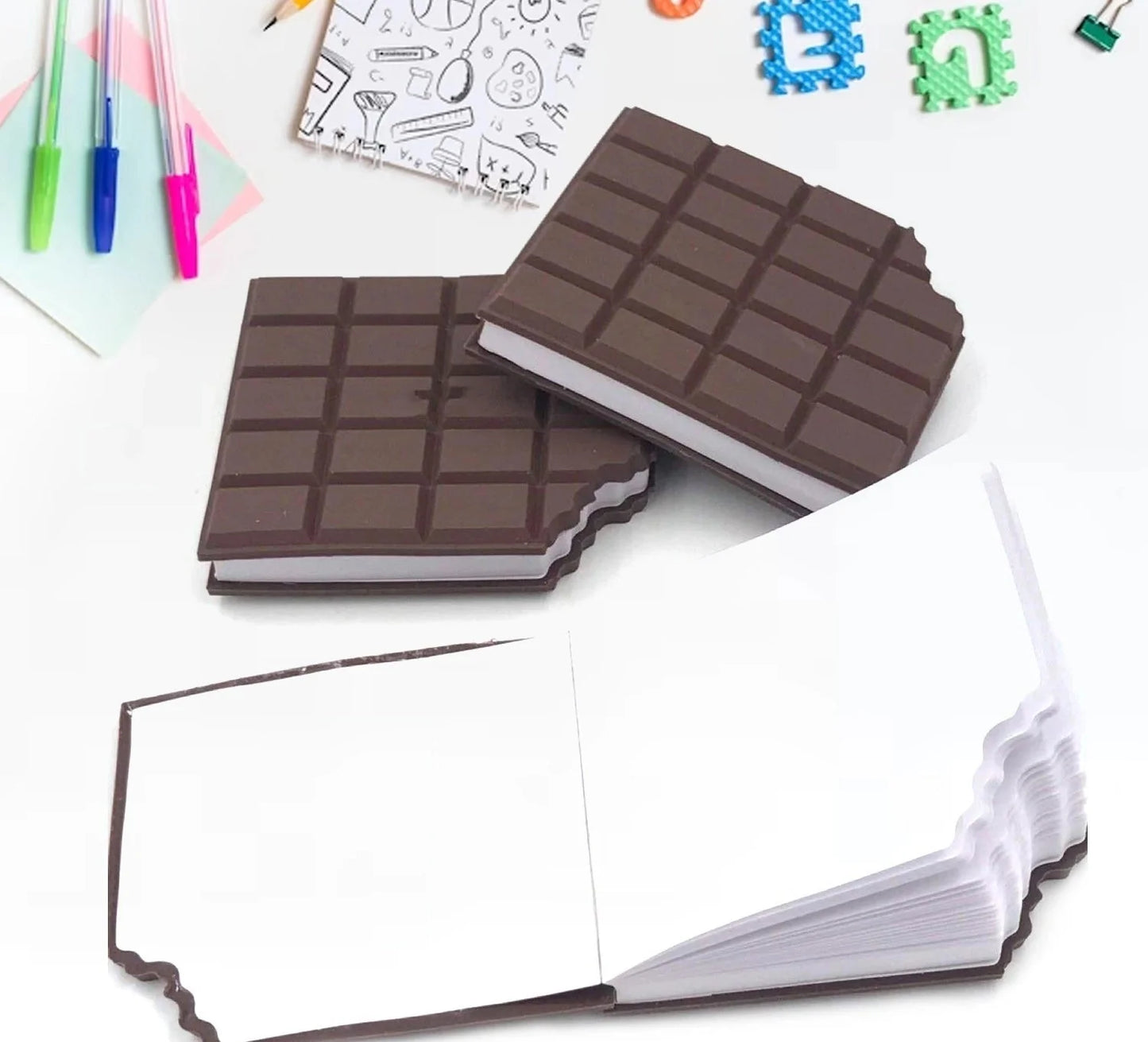 Mini notebook with dark brown chocolate-bar cover, open to blank pages