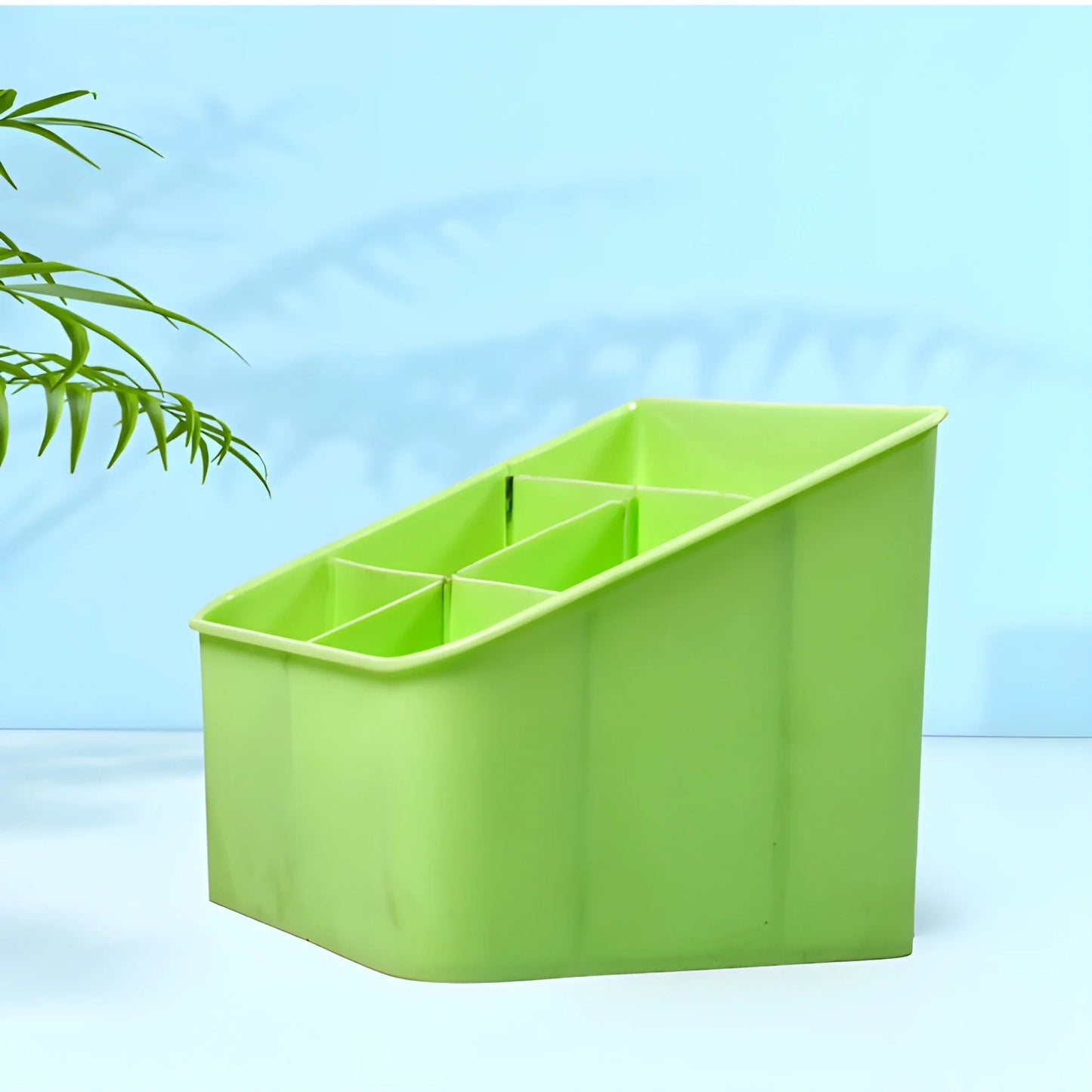 Green acrylic storage box with divided compartments, open top.