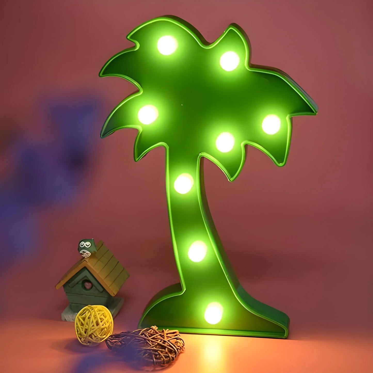Green LED palm tree night light with warm white glowing bulbs and base.