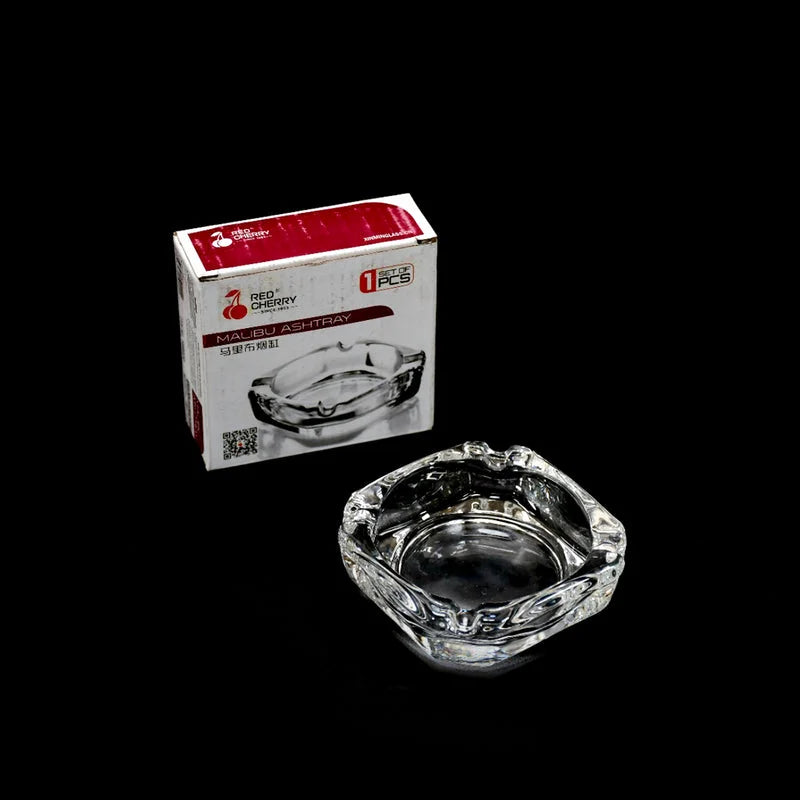 Round crystal glass ashtray with clear scalloped rim and center dish