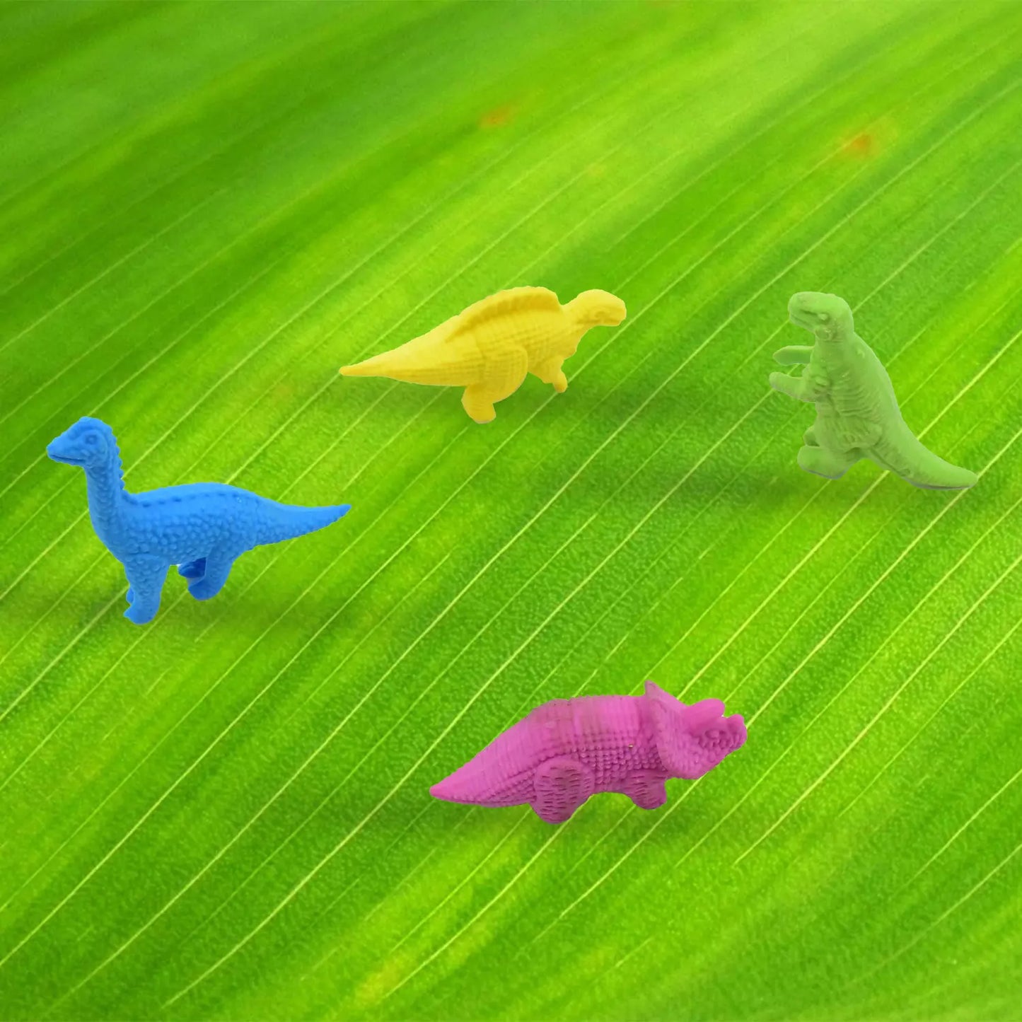 Dinosaur puzzle erasers set: blue, yellow, pink dinosaur shapes