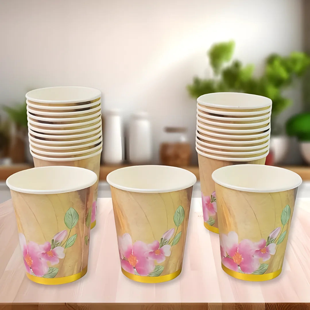 Disposable paper cups with floral print, stacked, with white rims