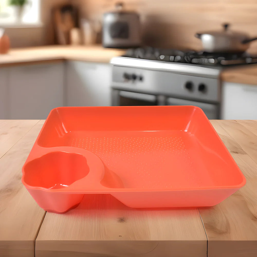 Dumpling sauce plate tray in bright orange with side sauce well and raised rim