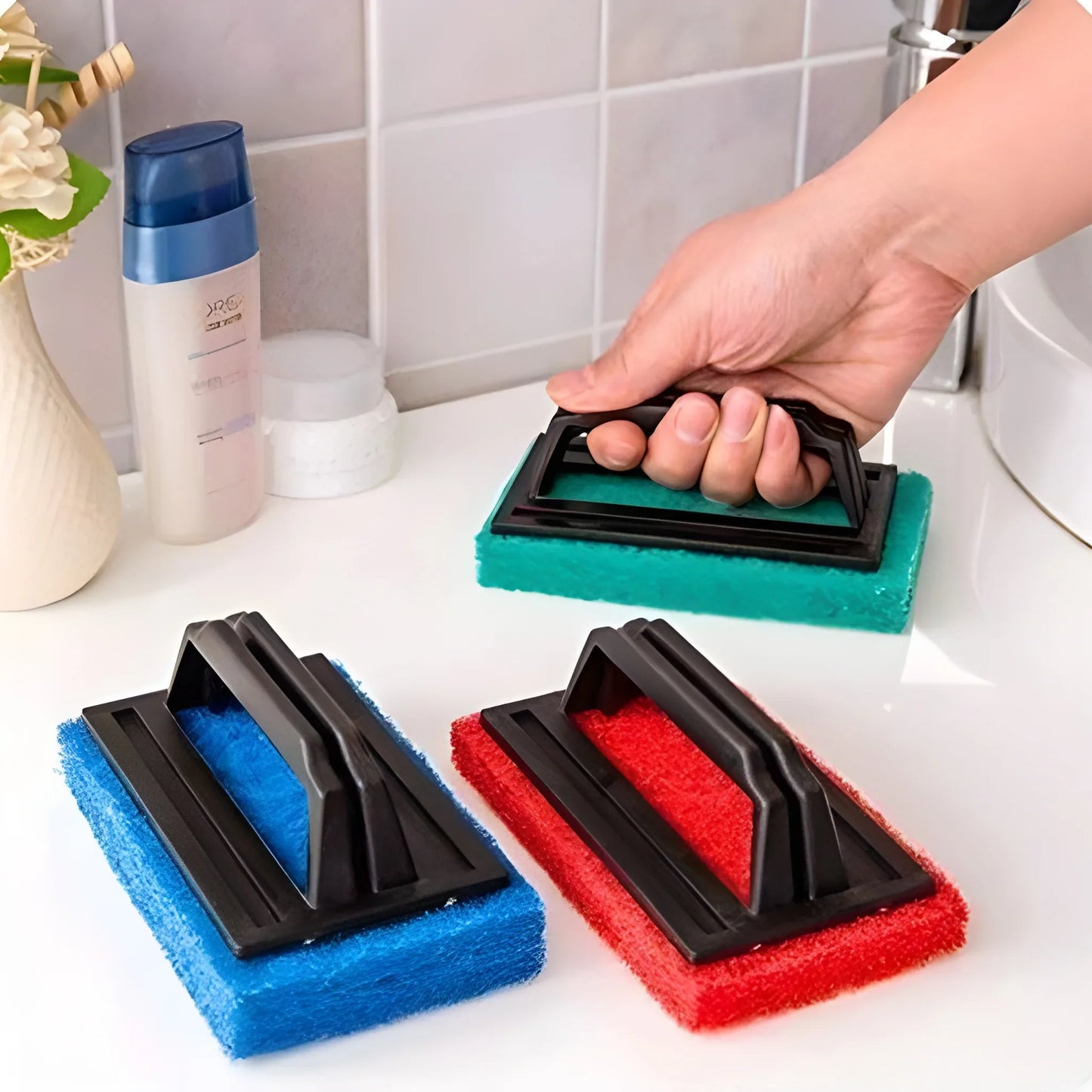 Ergonomic scrub brush with foam pads, black base, blue and red cleaning heads
