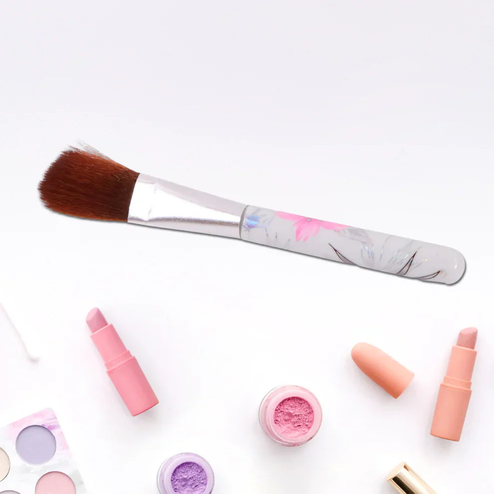 Floral makeup brush with white handle and pastel pattern, angled bristle tip