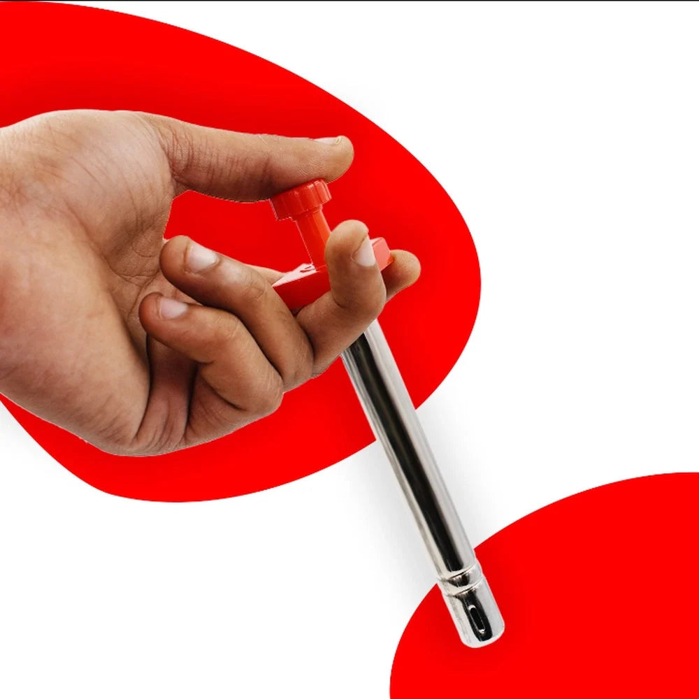 Red gas lighter with metal barrel, held in hand