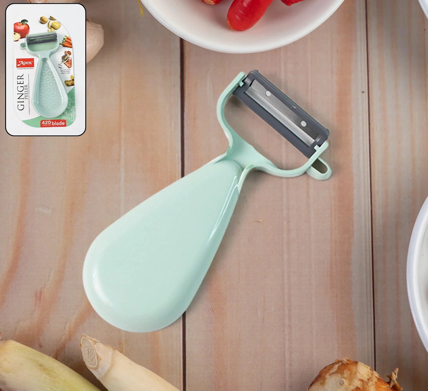 Mint green ginger peeler with attached grater blade and ergonomic handle