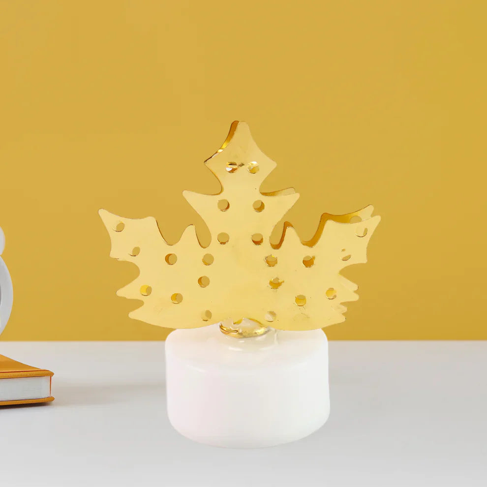 Gold leaf LED diya with gold-flake flame top on white wax base