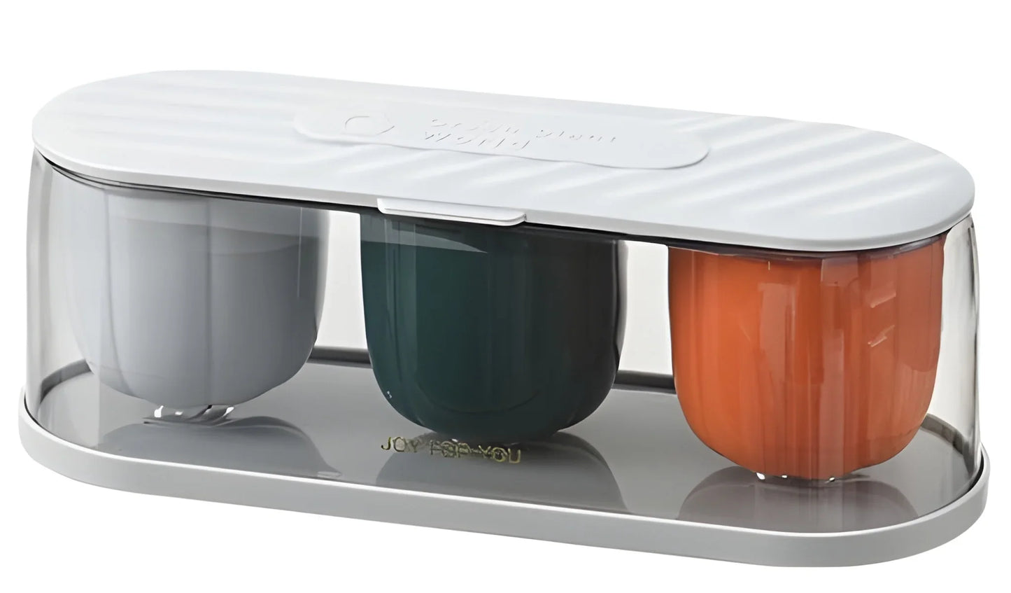 3-compartment seasoning spice container with three cups: orange, dark green, gray.