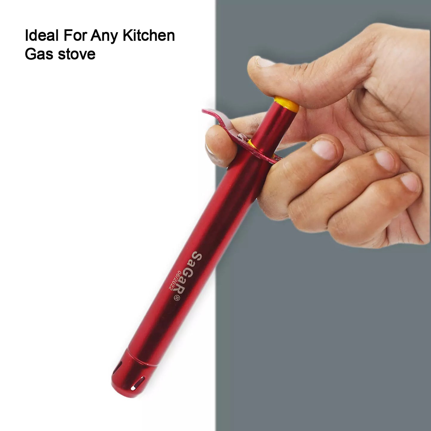 Red stainless steel gas lighter with flip ignition cap, held in hand