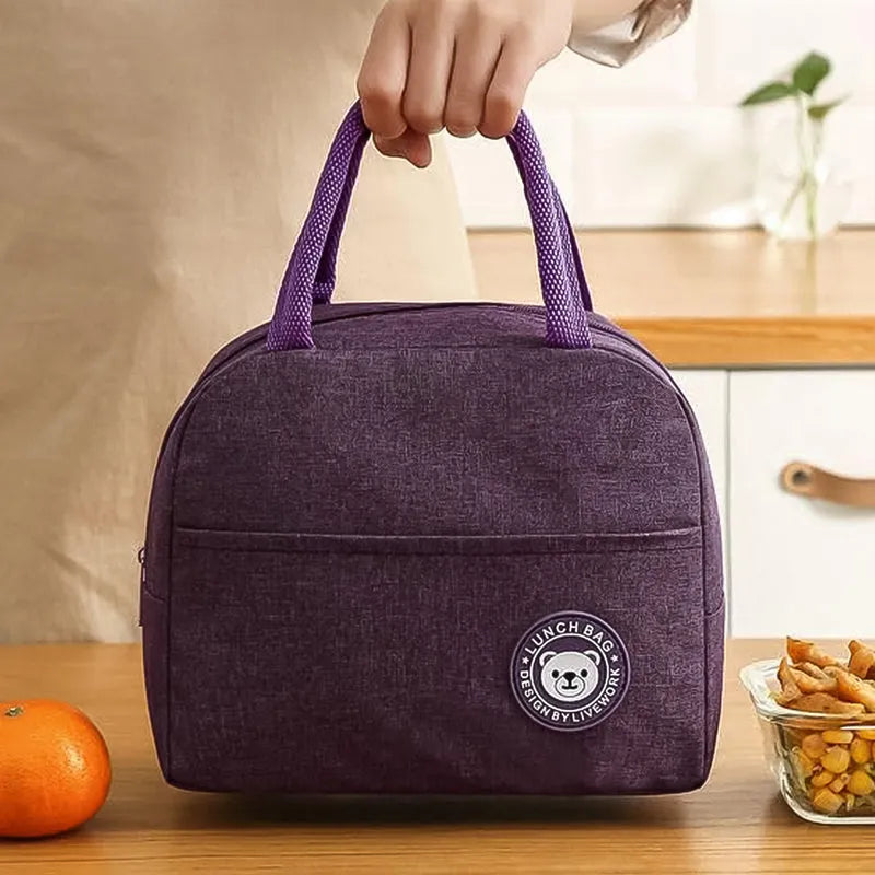 Insulated lunch bag with top handle and front patch logo, purple.