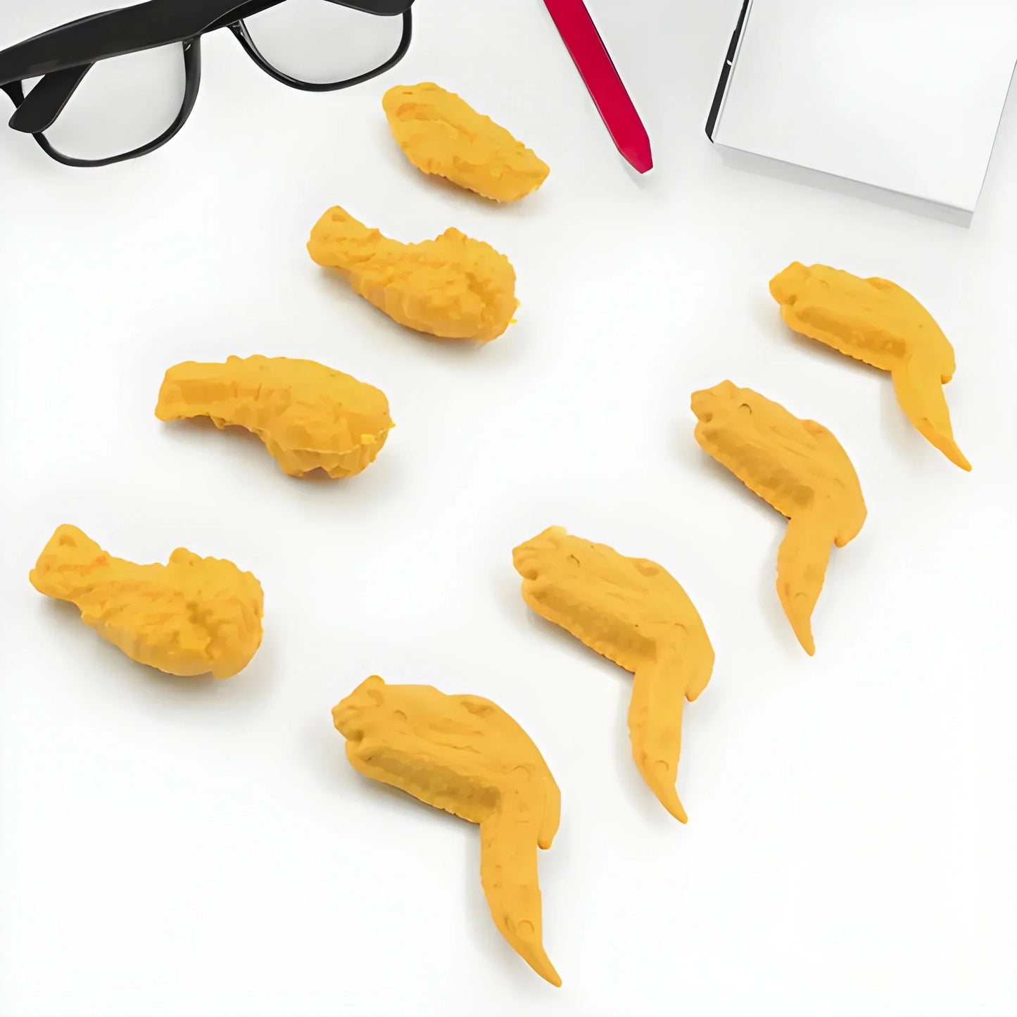 Chicken wing erasers, yellow, shaped like cartoon wings with small details