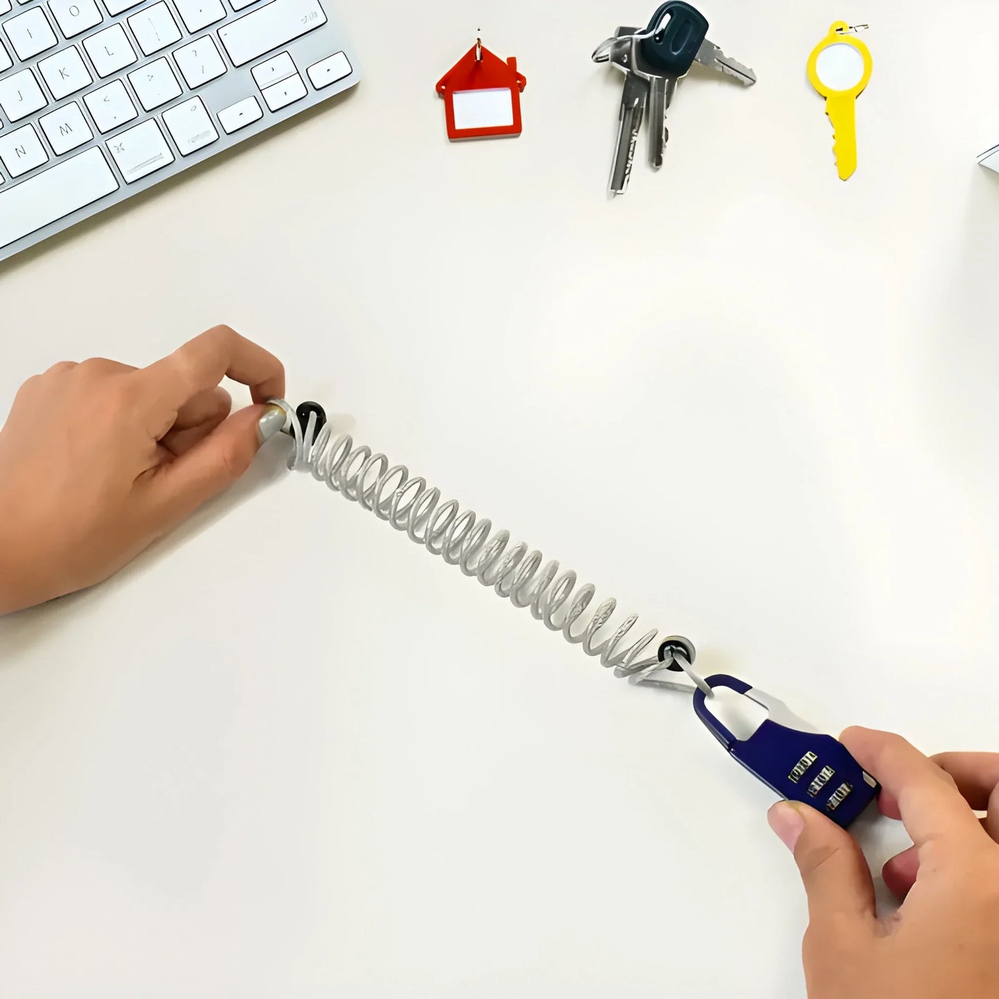 Keyless cable combination lock with coiled steel cable and blue lock body
