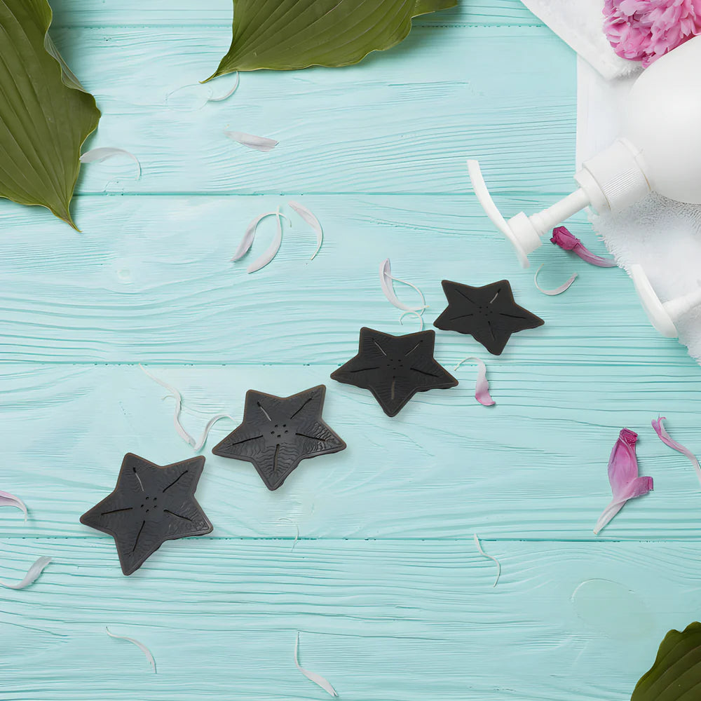 Star-shaped anti-slip mat pieces, dark gray, with textured grip dots