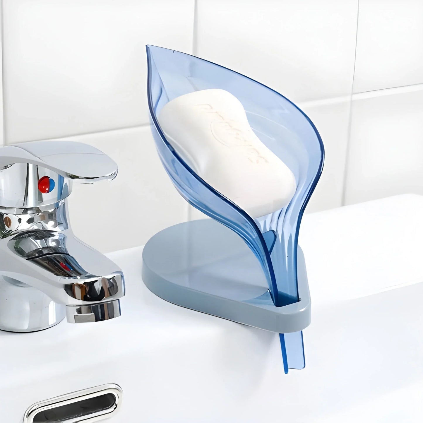 Leaf-shaped soap box holder with blue tray and white bar soap