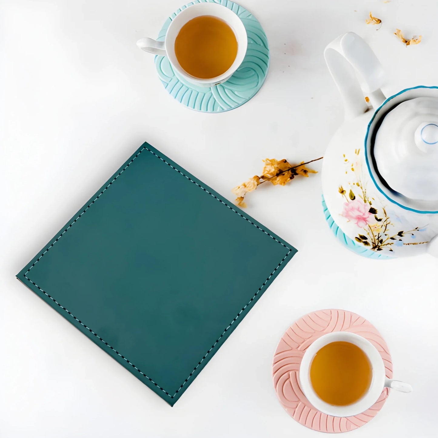 Teal leather drink coaster with edge stitching