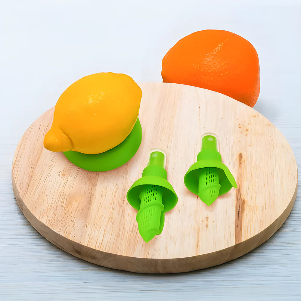Lemon citrus spray juicer set with two green sprayer nozzles on wooden board