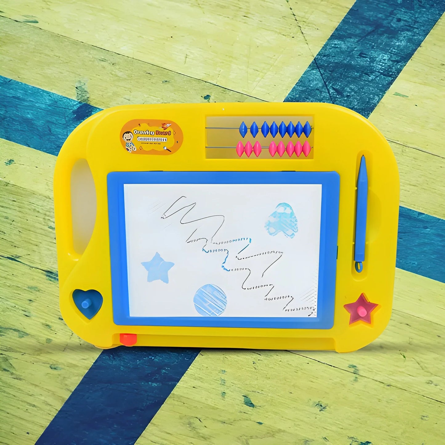 Yellow magic drawing slate with blue screen and star icons, includes stylus.