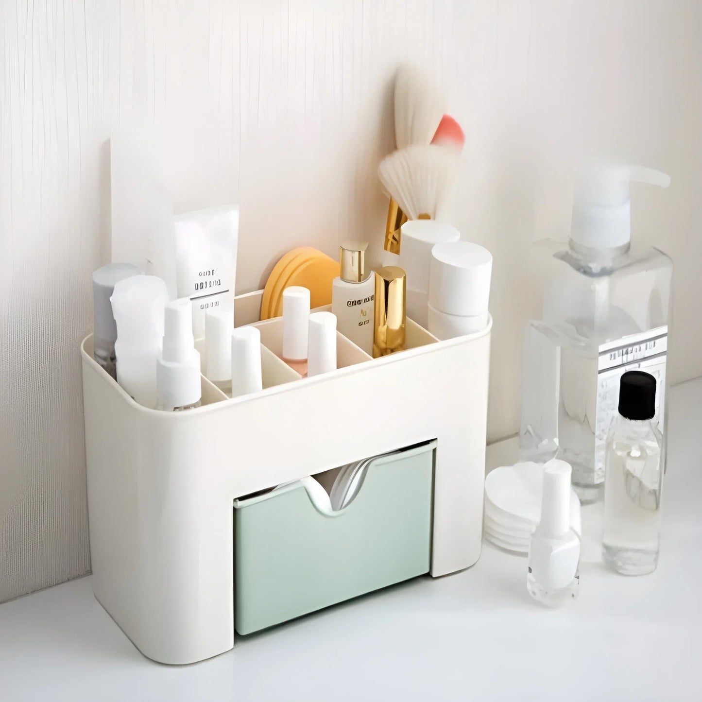 White makeup and jewelry organizer with open compartments and sliding drawer