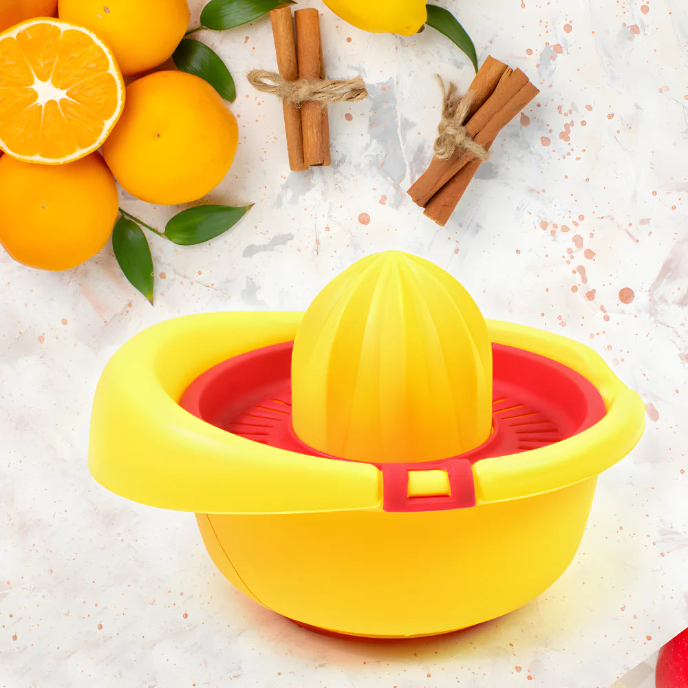 Manual citrus juicer, yellow bowl with raised reamer and red interior