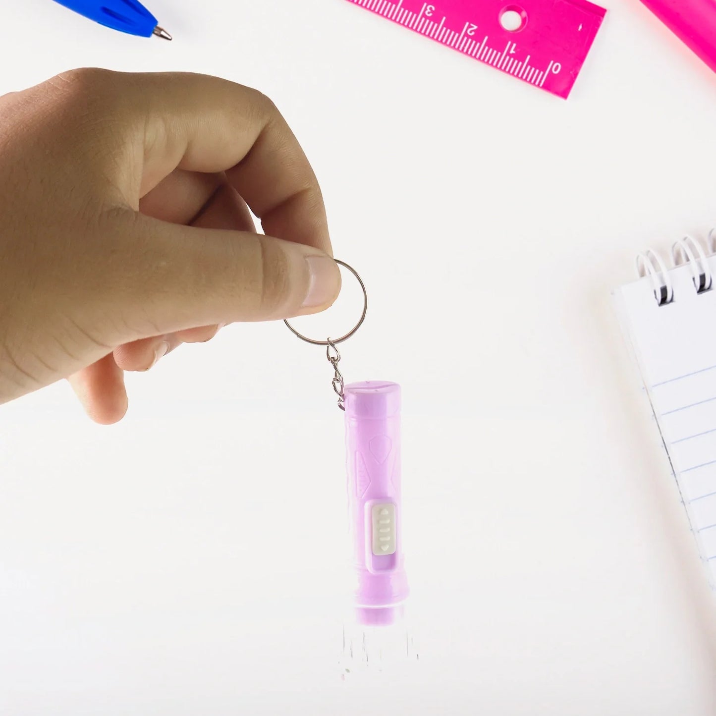 Mini LED keychain torch, purple cylinder with lanyard and side button