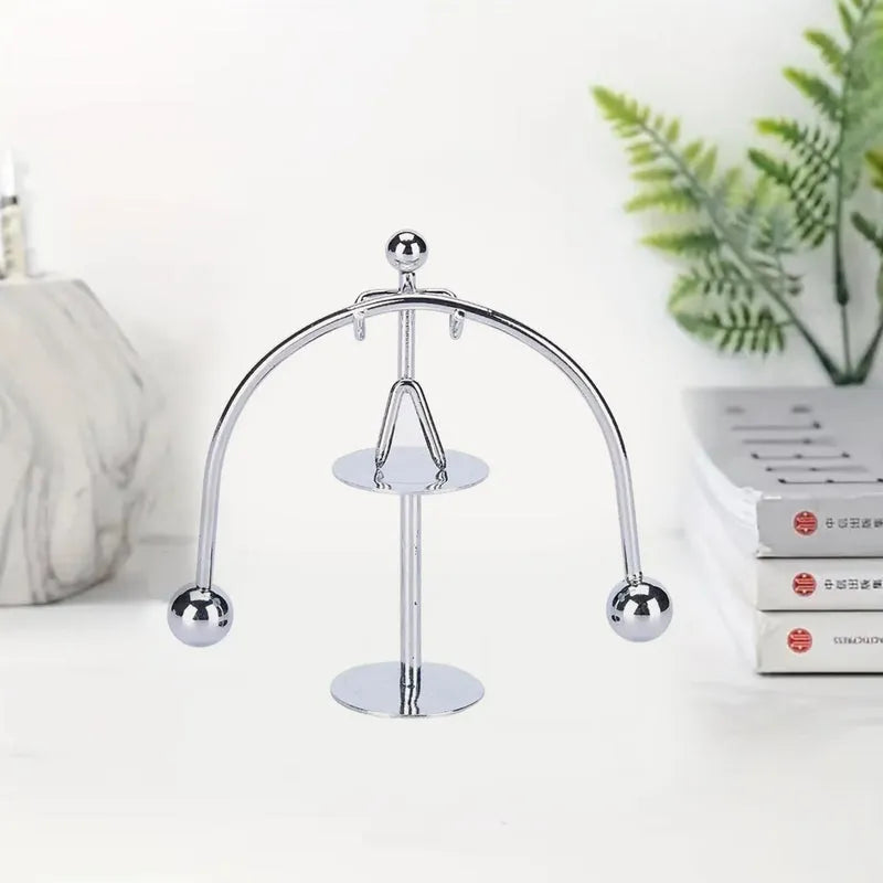 Mini steel balance toy with arched frame and two hanging metal balls