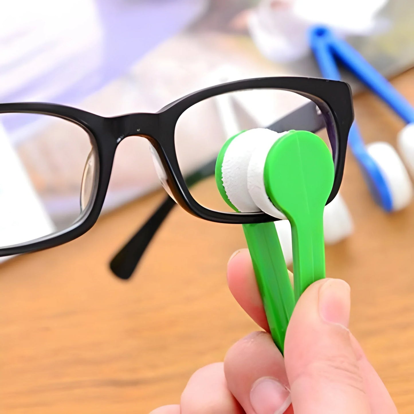 Mini microfiber eyeglass cleaner with green handle and circular white cleaning pad
