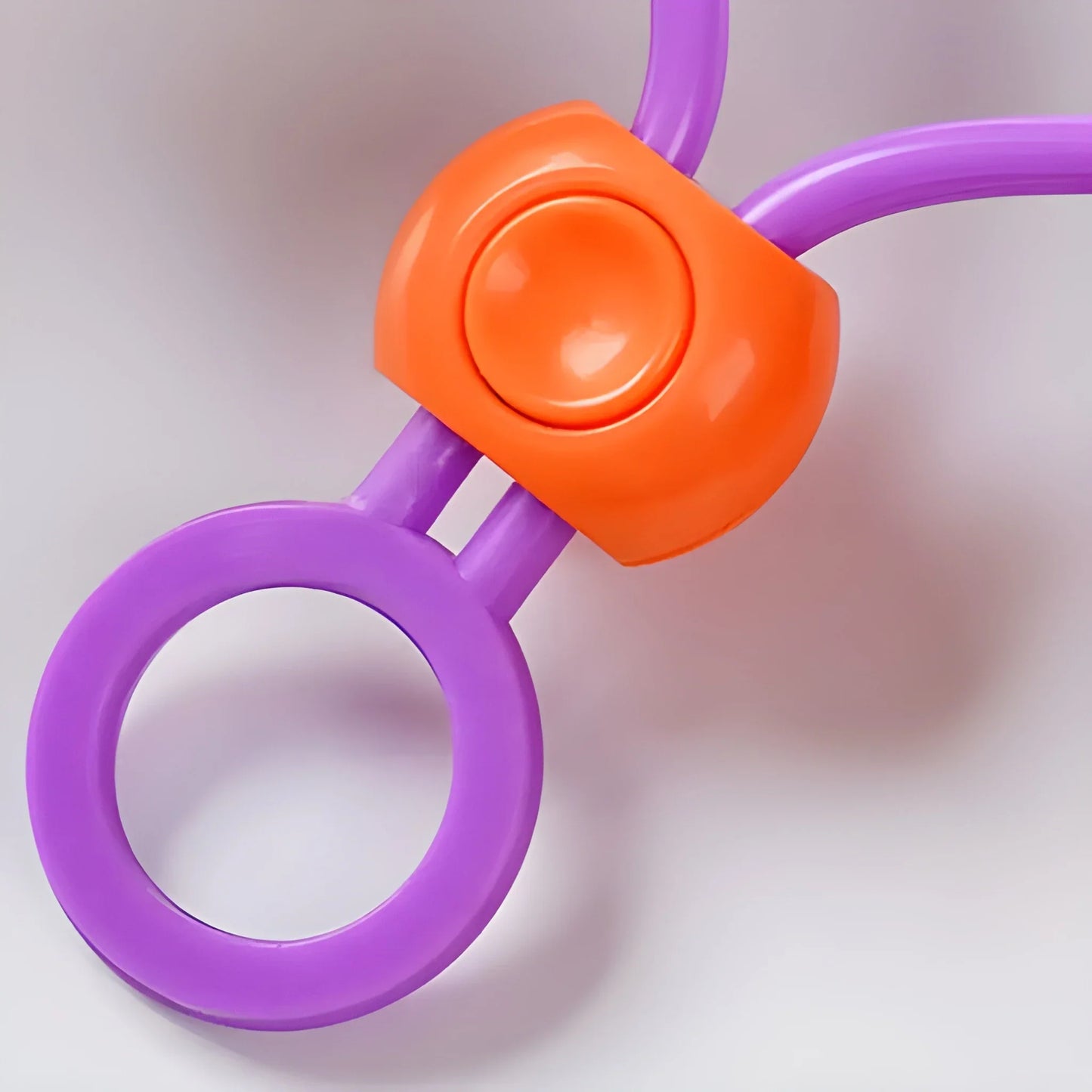 Multi-purpose bag clip with purple loop and orange snap handle