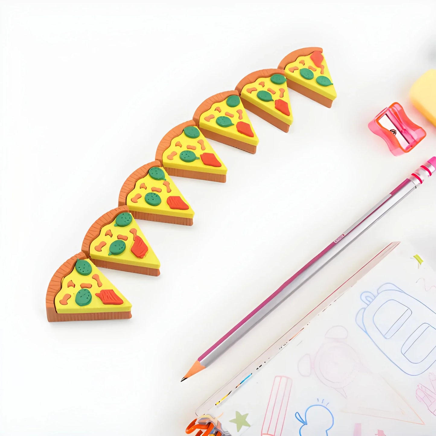 Pizza slice eraser set with colorful yellow cheese and green topping slices