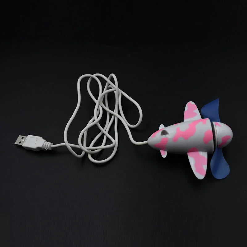 Plane design USB fan with pink and blue propeller, USB cable attached