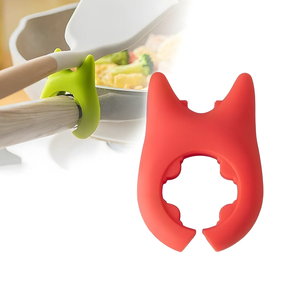Red plastic spoon rest with cat-shaped cutout