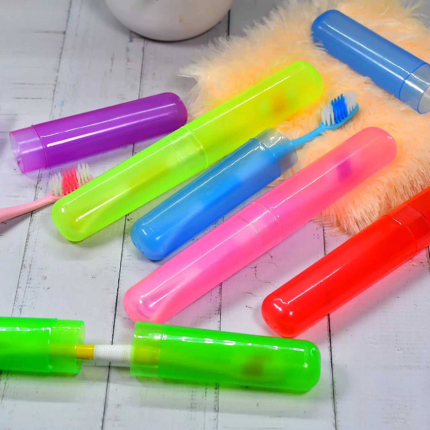 Plastic toothbrush cover set with colored protective tubes and brush heads