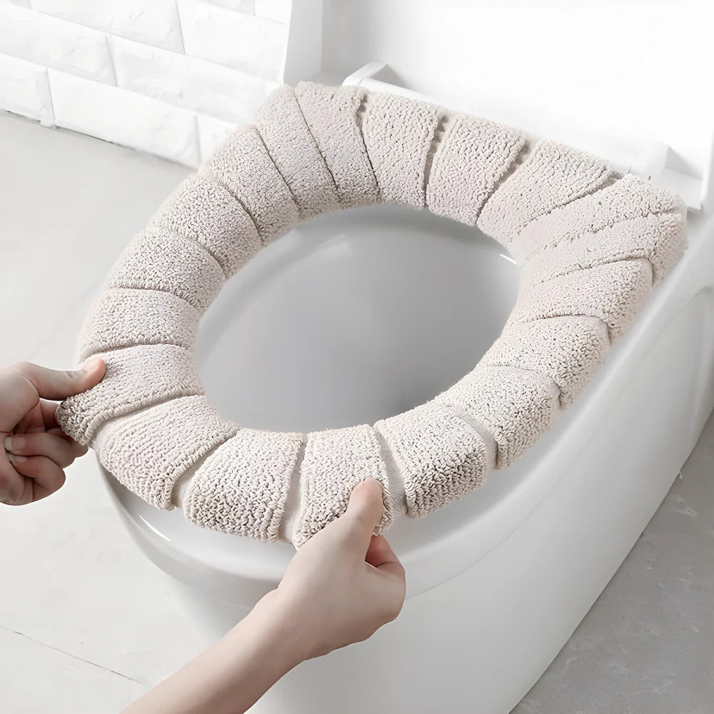 Plush toilet seat cover, light beige circular ring with textured fabric