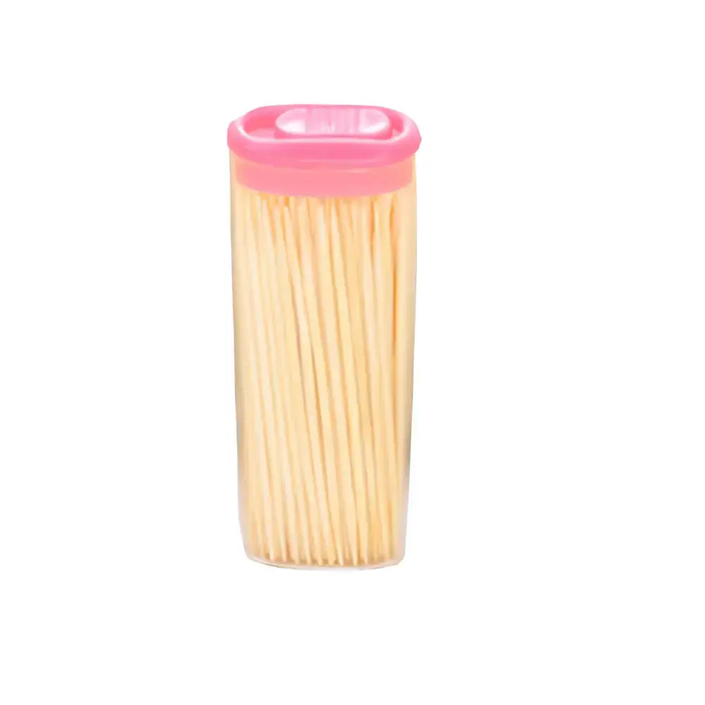 Bamboo toothpick jar with pink lid and light wooden toothpicks