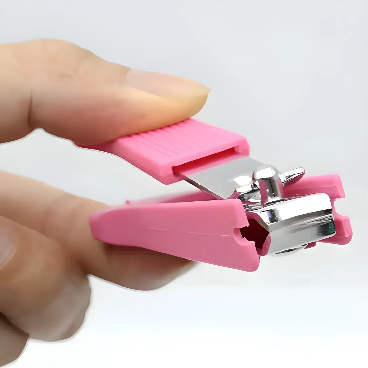 Pink nail clipper with metal cutting blades and lever