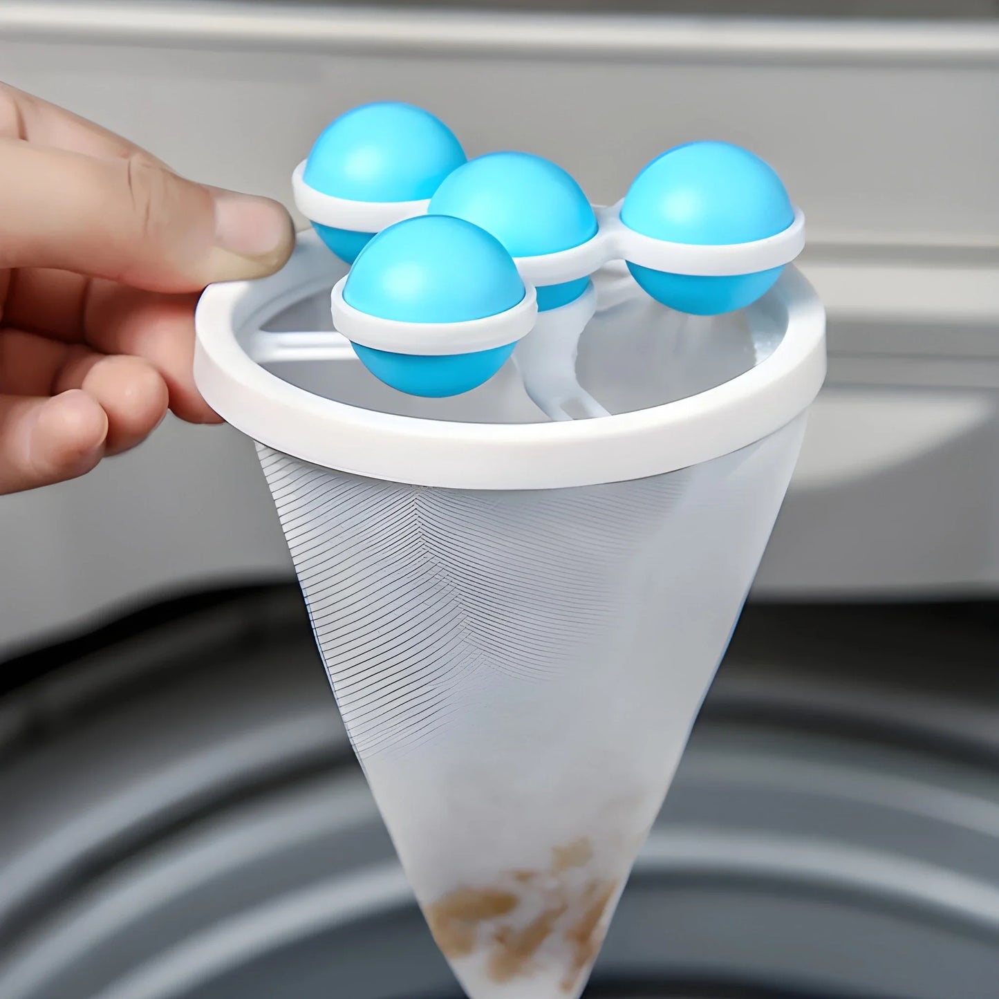 Reusable pet hair catcher with blue roller heads and white container